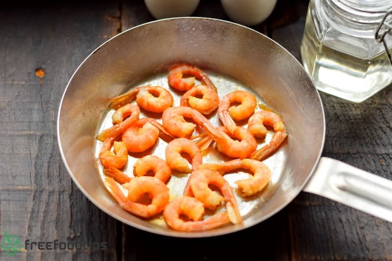 Fry shrimps in the skillet until golden brown Fry shrimps in the skillet until golden brown