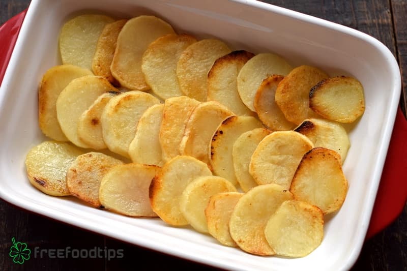 Layer fried potato slices