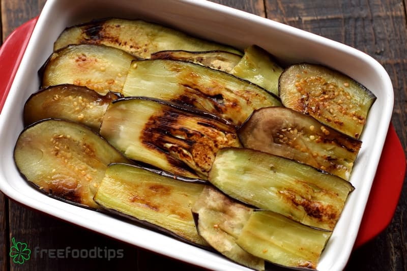 Add the layer of fried eggplant slices